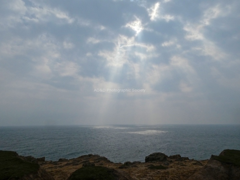 Sun through clouds, by Miggy Wild