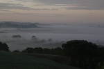 Daybreak with early morning mist tinged with a lit