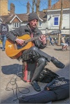 Street Musician, by John Cavana