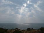Sun through clouds, by Miggy Wild